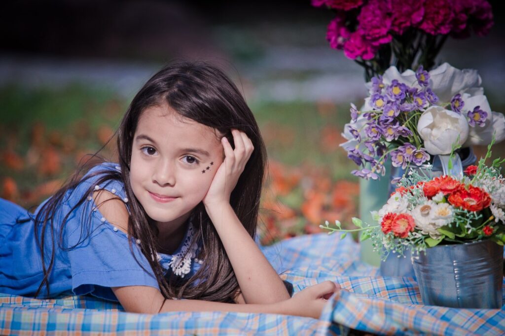 portrait-cute-girl-sitting-plant